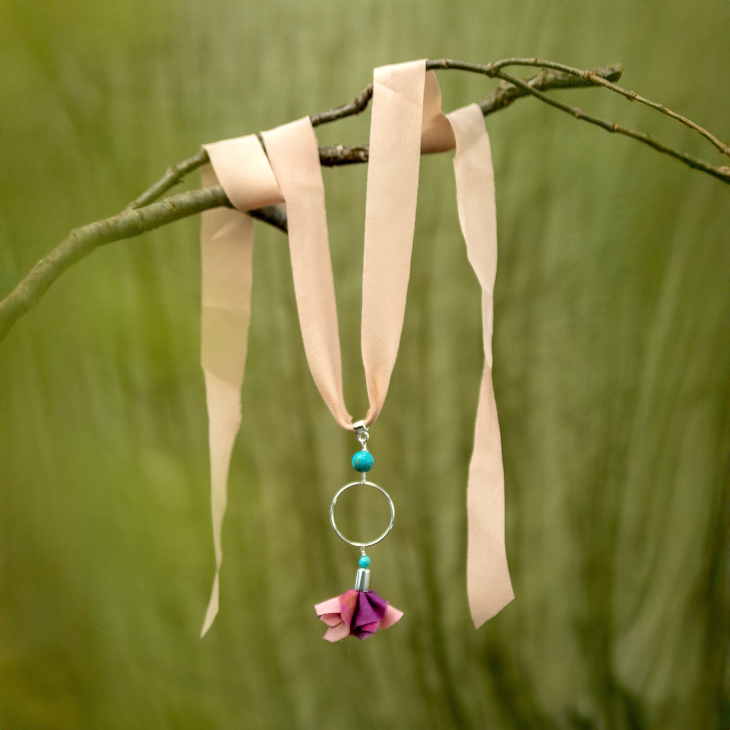 Necklace with pink flower and turquoise pendant